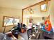 View of the ADU great room featuring an exposed beam cathedral ceiling, multiple windows and a ceiling fan at 8 Sioux Trl, Evergreen, CO 80439