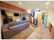 Basement featuring spiral staircase, fireplace, and media area at 8 Sioux Trl, Evergreen, CO 80439