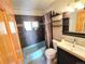 Bathroom featuring tiled walls, updated vanity, and tiled floors at 8 Sioux Trl, Evergreen, CO 80439