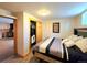 Cozy bedroom features wood-look flooring, closet, and decor at 8 Sioux Trl, Evergreen, CO 80439