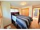 Bedroom with hardwood floors, natural light, and closet at 8 Sioux Trl, Evergreen, CO 80439