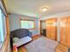 Bedroom featuring wood floors, natural light, and a closet at 8 Sioux Trl, Evergreen, CO 80439