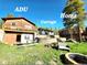 Exterior view of the house, ADU and garage surrounded by green grass and trees under a clear blue sky at 8 Sioux Trl, Evergreen, CO 80439