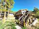 A well-maintained home with a back deck and stairs at 8 Sioux Trl, Evergreen, CO 80439