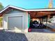 Spacious garage with a covered area for additional vehicles at 8 Sioux Trl, Evergreen, CO 80439