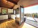 Bright kitchen with stainless steel appliances and access to a deck with stunning mountain views at 8 Sioux Trl, Evergreen, CO 80439