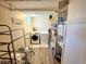 The laundry room with updated washer, dryer and ample storage at 8 Sioux Trl, Evergreen, CO 80439