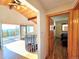 Bright living room with hardwood floors, vaulted ceilings, and a balcony overlooking scenic mountain views at 8 Sioux Trl, Evergreen, CO 80439
