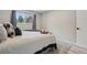 A cozy bedroom featuring modern decor, a comfortable bed, and a bright window view at 5300 E Cherry Creek South Drive # 918, Denver, CO 80246