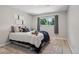 A cozy bedroom featuring modern decor, a comfortable bed, and a bright window view at 5300 E Cherry Creek South Drive # 918, Denver, CO 80246