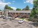 Condo exterior showcases private wooden stairways, balconies, and adjacent parking in a well-kept complex at 5300 E Cherry Creek South Drive # 918, Denver, CO 80246