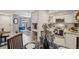 Bright kitchen featuring white cabinets, stainless steel appliances, and a dining area at 5300 E Cherry Creek South Drive # 918, Denver, CO 80246