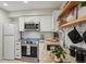 Updated kitchen with stainless steel appliances, granite countertops and white cabinetry at 5300 E Cherry Creek South Drive # 918, Denver, CO 80246