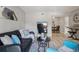 Comfortable living room with a dark leather sofa, TV and modern decor at 5300 E Cherry Creek South Drive # 918, Denver, CO 80246