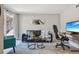 Open living room featuring a slider door, dark leather sofa and a comfortable chair at 5300 E Cherry Creek South Drive # 918, Denver, CO 80246