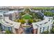 Stunning aerial view of a community park with lush green space and surrounding modern buildings and tree-lined streets at 7700 E 29 Ave # 304, Denver, CO 80238