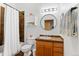 Traditional bathroom with modern sink, medicine cabinet, and dark backsplash tiling at 7700 E 29 Ave # 304, Denver, CO 80238