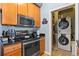 Well-equipped kitchen with stainless steel appliances and access to washer and dryer at 7700 E 29 Ave # 304, Denver, CO 80238