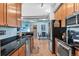 Well-lit kitchen with modern appliances, sleek countertops, and an adjacent dining area for convenient living at 7700 E 29 Ave # 304, Denver, CO 80238