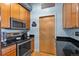 Well-equipped kitchen with stainless steel appliances, granite countertops, and ample cabinet space at 7700 E 29 Ave # 304, Denver, CO 80238