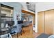 A comfortable space with modern desk setup, hardwood floors, and a sliding door at 7700 E 29 Ave # 304, Denver, CO 80238