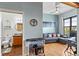 A living room with a desk, wet bar, and access to a bathroom at 7700 E 29 Ave # 304, Denver, CO 80238