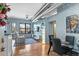 Bright living room featuring exposed ductwork, hardwood floors, and a cozy seating area with city views at 7700 E 29 Ave # 304, Denver, CO 80238