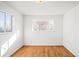 Well-lit bedroom showcasing hardwood floors and a large window at 1065 Youngfield St, Golden, CO 80401