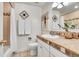 Bathroom features neutral tile floors, granite countertops, white cabinets and shower with curtain at 11488 E Amherst S Cir, Aurora, CO 80014