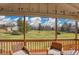 Covered patio providing a lovely view of the surrounding green landscape and blue skies at 11488 E Amherst S Cir, Aurora, CO 80014