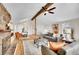 Bright living room with stone fireplace, hardwood floors, and comfortable seating arrangement at 11488 E Amherst S Cir, Aurora, CO 80014