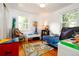 Fun room with hardwood floors, a blue bed, colorful toys, and a sunny window at 2240 S Clermont St, Denver, CO 80222