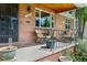Inviting front porch with seating, showcasing a charming and welcoming entrance at 2240 S Clermont St, Denver, CO 80222