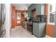 Modern kitchen with gray cabinets, stainless steel appliances, and mosaic tile backsplash at 2240 S Clermont St, Denver, CO 80222