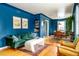 Bright living room features hardwood floors, comfortable seating, and an adjacent dining area at 2240 S Clermont St, Denver, CO 80222