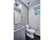 Modern bathroom with concrete sink and gray tile at 1825 Grove St, Denver, CO 80204