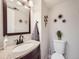 Bathroom with granite sink and bronze fixtures at 5525 S Lowell Blvd, Littleton, CO 80123