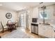Bright dining area featuring a stylish table set, hardwood floors, and easy access to the outdoor patio at 5525 S Lowell Blvd, Littleton, CO 80123