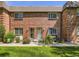 Charming brick facade with well-manicured lawn, inviting entrance, and cozy curb appeal on a sunny day at 5525 S Lowell Blvd, Littleton, CO 80123