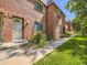 Charming brick facade with well-manicured lawn, inviting entrance, and cozy curb appeal on a sunny day at 5525 S Lowell Blvd, Littleton, CO 80123