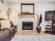 Elegant fireplace with decorative mantel, creating a cozy focal point in the living room with stylish decor at 5525 S Lowell Blvd, Littleton, CO 80123