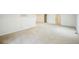 Large carpeted space with neutral paint, and multiple electrical outlets throughout at 3366 Willow St, Denver, CO 80238