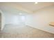 Spacious finished basement with neutral carpet, ample lighting, and plenty of room to customize at 3366 Willow St, Denver, CO 80238