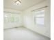 Bedroom featuring three windows at 3366 Willow St, Denver, CO 80238