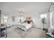 Bright bedroom featuring a chandelier and contemporary decor at 3366 Willow St, Denver, CO 80238