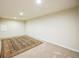 This bonus room is carpeted, has neutral paint, and a large area rug at 3366 Willow St, Denver, CO 80238