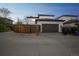 Exterior view of a modern two-story home with a dark gray attached two-car garage at 3366 Willow St, Denver, CO 80238