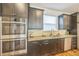 Modern kitchen featuring granite countertops, stainless steel appliances, and custom cabinetry at 3366 Willow St, Denver, CO 80238