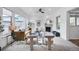 Inviting living room featuring plush seating, a cozy fireplace, large windows and natural light at 3366 Willow St, Denver, CO 80238