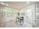 Bright office featuring three windows, a desk, and a stylish chair at 3366 Willow St, Denver, CO 80238